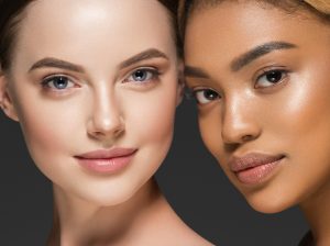Two women with smooth youthful skin and defined features representing the rejuvenating effects of dermal fillers