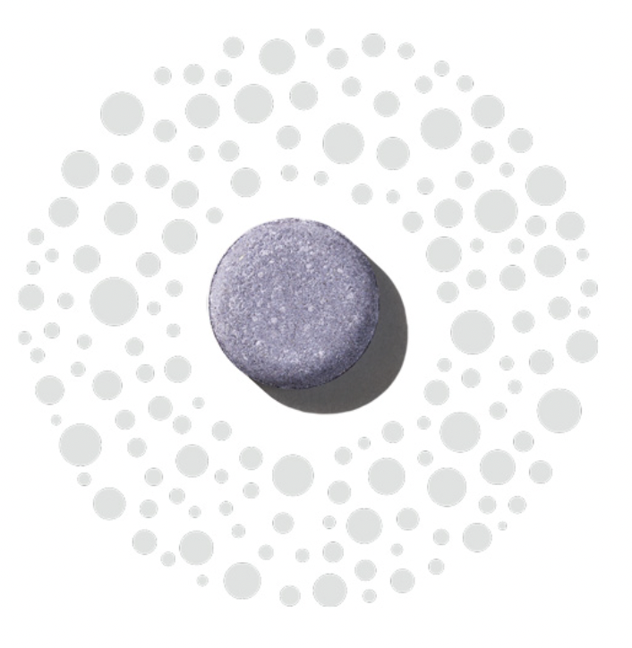 Oxygeneo purple treatment capsule on a dotted white background