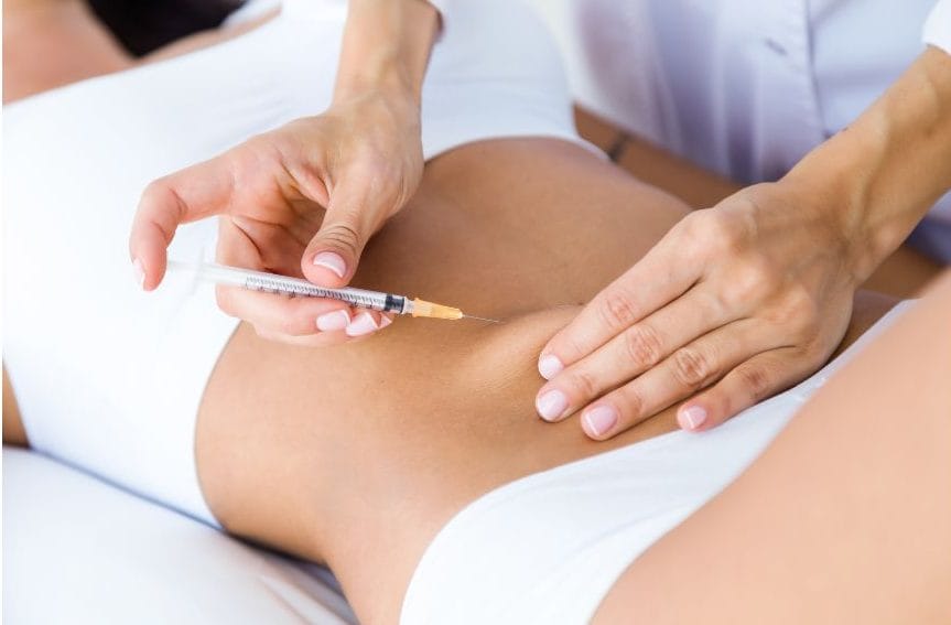 woman receiving abdominal injection for weight loss treatment